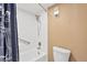 A well-maintained, tiled bathroom with a shower-tub combo and safety bar at 6009 Sea Ranch Dr # 307, Hudson, FL 34667