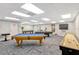 Game room featuring pool tables and shuffleboard table for endless entertainment opportunities at 6009 Sea Ranch Dr # 307, Hudson, FL 34667
