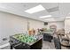 Game room featuring foosball, pool table, poker table, card table, and cozy seating area for leisure at 6009 Sea Ranch Dr # 307, Hudson, FL 34667