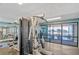Modern gym featuring weight machines and panoramic views of the landscape for a complete fitness experience at 6009 Sea Ranch Dr # 307, Hudson, FL 34667