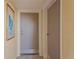 Hallway with the unit's front door and a doorway to another room at 6009 Sea Ranch Dr # 307, Hudson, FL 34667