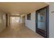 Hallway with a view of unit 307 and other units with exterior access at 6009 Sea Ranch Dr # 307, Hudson, FL 34667