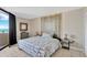 The main bedroom features a comfortable bed, accent wall, and ocean view balcony at 6009 Sea Ranch Dr # 307, Hudson, FL 34667