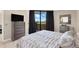 Comfortable main bedroom with a dresser and large windows overlooking the waterfront at 6009 Sea Ranch Dr # 307, Hudson, FL 34667