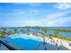 Beautiful pool with waterfront views, perfect for relaxation and enjoying the sunny weather at 6009 Sea Ranch Dr # 307, Hudson, FL 34667