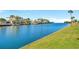 Picturesque waterfront view of adjacent houses with boat docks and clear water views at 6009 Sea Ranch Dr # 307, Hudson, FL 34667