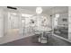 View of dining area with mirrored wall and breakfast bar with access to the kitchen at 6279 Sun Blvd # 605, St Petersburg, FL 33715