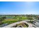 This property offers an aerial view of the surrounding golf course, pond, and city at 6279 Sun Blvd # 605, St Petersburg, FL 33715