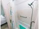 Classic white tiled bathroom with a bathtub-shower and convenient safety grab bar at 6315 25Th N Ave, St Petersburg, FL 33710