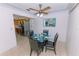 Cozy dining area with a modern glass table, contemporary chairs, and terrazzo flooring at 6315 25Th N Ave, St Petersburg, FL 33710