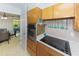 Well-equipped kitchen featuring wooden cabinets, stainless steel appliances, and modern countertops at 6315 25Th N Ave, St Petersburg, FL 33710