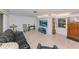 Comfortable living area with terrazzo floors, a flat-screen TV, and traditional decor at 6315 25Th N Ave, St Petersburg, FL 33710