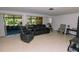 Bright living room featuring terrazzo floors, neutral paint, and sliding doors to the lanai at 6315 25Th N Ave, St Petersburg, FL 33710