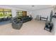 Bright living room featuring neutral walls, a cozy seating arrangement, and access to a sunroom at 6315 25Th N Ave, St Petersburg, FL 33710