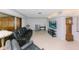 Spacious living room with modern furnishings, terrazzo flooring, and a wall-mounted TV at 6315 25Th N Ave, St Petersburg, FL 33710