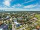Aerial view of neighborhood showcasing lush landscaping, nearby lakes, and surrounding residential properties at 735 Snell Isle Ne Blvd, St Petersburg, FL 33704