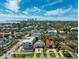 Beautiful aerial view of the neighborhood with city skyline, water, and mature landscaping at 735 Snell Isle Ne Blvd, St Petersburg, FL 33704