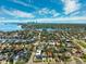 Aerial view of neighborhood, highlighting location with waterfront views and skyline in the distance at 735 Snell Isle Ne Blvd, St Petersburg, FL 33704