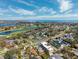 Stunning aerial view of a home near a lush golf course with mature trees and landscaping at 735 Snell Isle Ne Blvd, St Petersburg, FL 33704