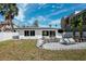 A backyard featuring a lovely patio and a comfortable seating area at 735 Snell Isle Ne Blvd, St Petersburg, FL 33704