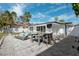 Back patio with outdoor furniture perfect for entertaining in a private outdoor oasis at 735 Snell Isle Ne Blvd, St Petersburg, FL 33704