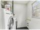 Laundry room with modern washer and dryer and water heater at 7711 Amherst St # A & B, Tampa, FL 33625