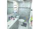 Bathroom featuring marble tiled walls, vanity, a toilet and decorative toiletries at 8630 Winter Haven Dr, Hudson, FL 34667