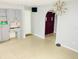 Bright dining room with built-in storage and view into front entryway, great for entertaining at 8630 Winter Haven Dr, Hudson, FL 34667