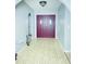 Inviting entryway with beautiful flooring and arched doorways, leading to other rooms at 8630 Winter Haven Dr, Hudson, FL 34667