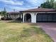 Charming single-story home with well-manicured lawn and beautiful landscaping at 8630 Winter Haven Dr, Hudson, FL 34667