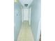 Bright hallway featuring neutral paint and tile, and access to all rooms at 8630 Winter Haven Dr, Hudson, FL 34667