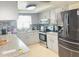 Well-equipped kitchen featuring granite countertops, modern appliances, and ample storage space at 8630 Winter Haven Dr, Hudson, FL 34667