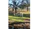 Outdoor space with a decorative garden bench set offers peaceful respite, surrounded by lush greenery at 8946 Old Pasco Rd, Wesley Chapel, FL 33544