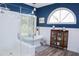 Bathroom with glass shower, large arched window and freestanding tub at 8946 Old Pasco Rd, Wesley Chapel, FL 33544