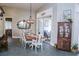 Elegant dining room with stylish decor, a large window, and seating for the whole Gathering at 8946 Old Pasco Rd, Wesley Chapel, FL 33544