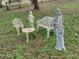 Ornate garden furniture and statues create a peaceful and inviting outdoor space at 8946 Old Pasco Rd, Wesley Chapel, FL 33544