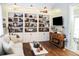 Living room featuring built-in shelving, hardwood floors, sofa, coffee table, and decorative accents at 8946 Old Pasco Rd, Wesley Chapel, FL 33544