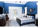 Well-lit main bedroom with access to the pool area and featuring traditional decor at 8946 Old Pasco Rd, Wesley Chapel, FL 33544