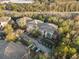 Aerial view of multi-Gathering buildings with parking lots and surrounding trees at 17106 Carrington Park Dr # 627, Tampa, FL 33647