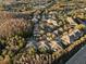 Aerial view of apartments surrounded by trees and a nearby highway at 17106 Carrington Park Dr # 627, Tampa, FL 33647