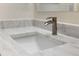 Close up of bathroom sink with marble countertop and modern faucet at 17106 Carrington Park Dr # 627, Tampa, FL 33647