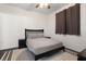 Bedroom with dark furniture, ceiling fan, neutral walls and area rug at 17106 Carrington Park Dr # 627, Tampa, FL 33647