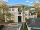 Inviting exterior of a multi-story condo building featuring stucco siding and palm trees at 17106 Carrington Park Dr # 627, Tampa, FL 33647