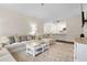 Open-concept living area showcasing modern decor, comfortable seating, and seamless flow to kitchen at 17106 Carrington Park Dr # 627, Tampa, FL 33647