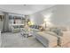 Spacious living room featuring modern furniture, large windows, and neutral decor at 17106 Carrington Park Dr # 627, Tampa, FL 33647