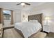Spacious bedroom featuring a comfortable bed, ceiling fan, and neutral decor at 17106 Carrington Park Dr # 627, Tampa, FL 33647