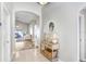 Entryway with console table, arched doorways, and view of the living room at 10120 Somersby Dr, Riverview, FL 33578