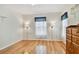 Bright bedroom featuring hardwood floors, neutral walls, and dual lamps for a cozy, inviting atmosphere at 10416 Moshie Ln, San Antonio, FL 33576
