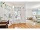A cozy breakfast nook with large windows dressed in flowing white curtains at 10416 Moshie Ln, San Antonio, FL 33576