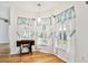 Bright breakfast nook area with ample natural light and a vintage sewing machine at 10416 Moshie Ln, San Antonio, FL 33576